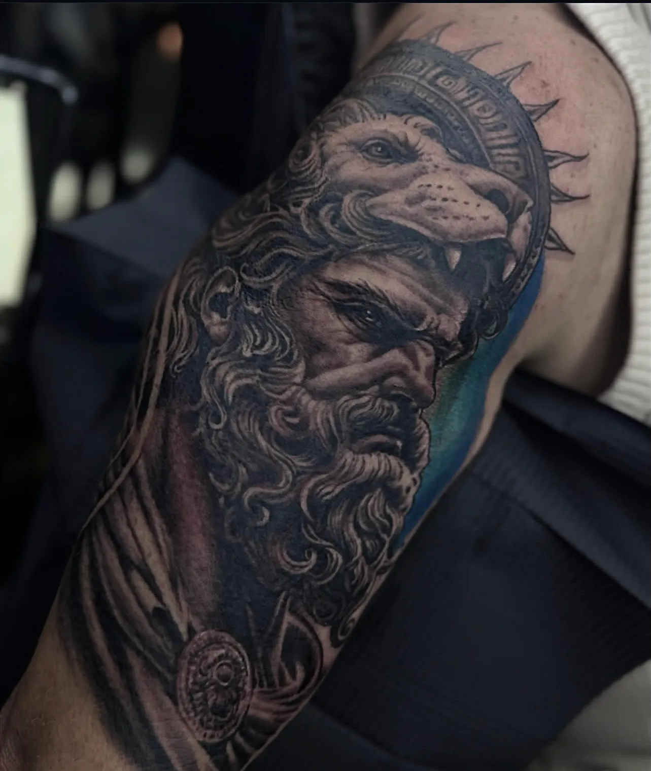 Realism Hercules warrior wearing a lion pelt arm tattoo by Bishop Kelly