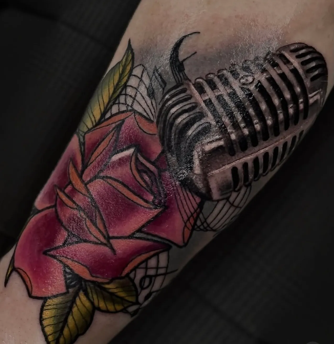 Color neotraditional rose and vintage microphone forearm tattoo by Bishop Kelly