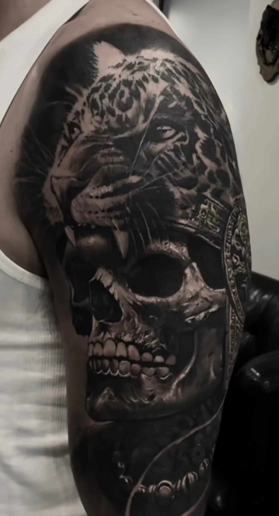 Black and grey jaguar warrior and skull arm sleeve by JP Alfonso