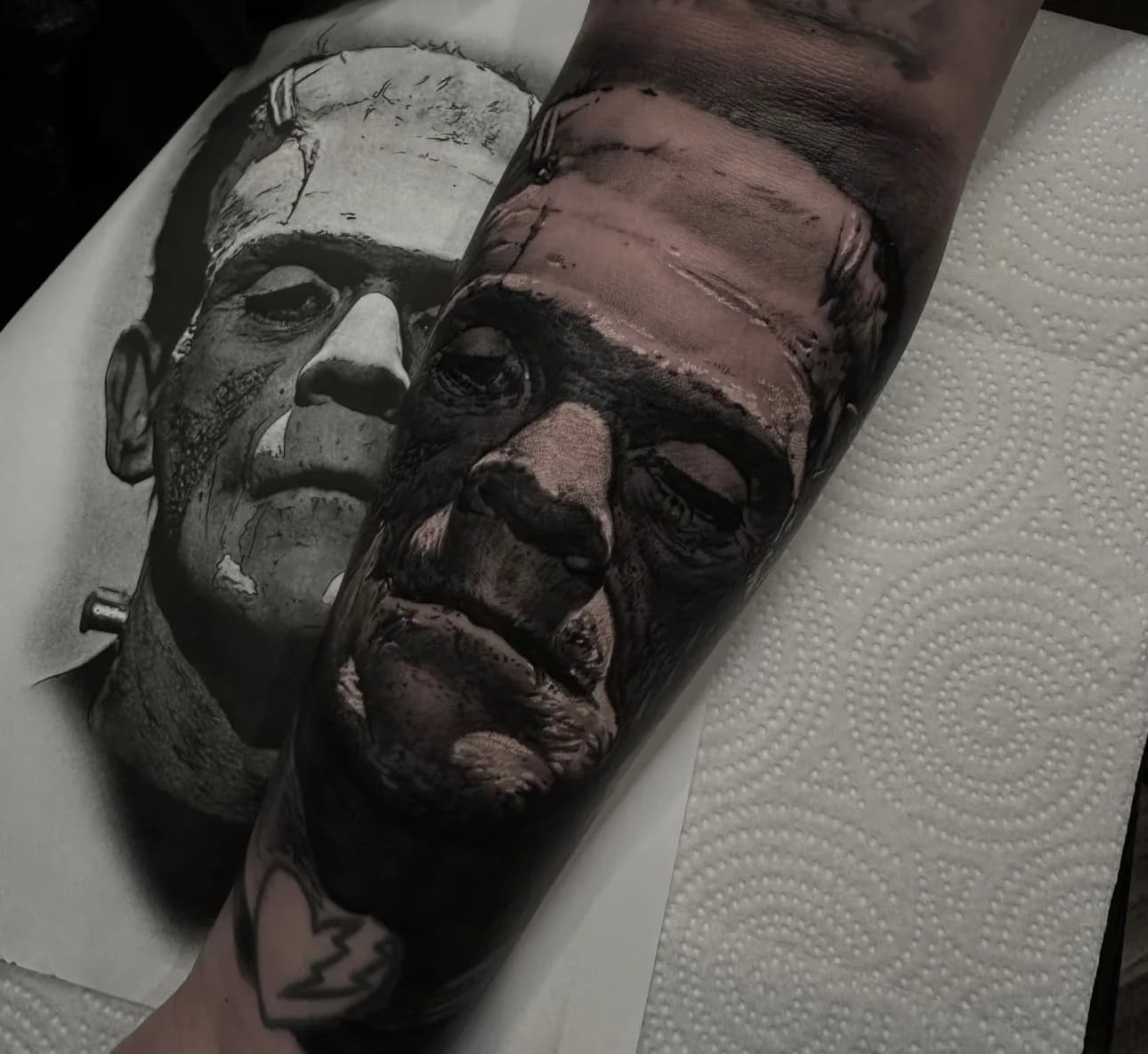 Black and grey Frankenstein's monster portrait forearm tattoo by JP Alfonso