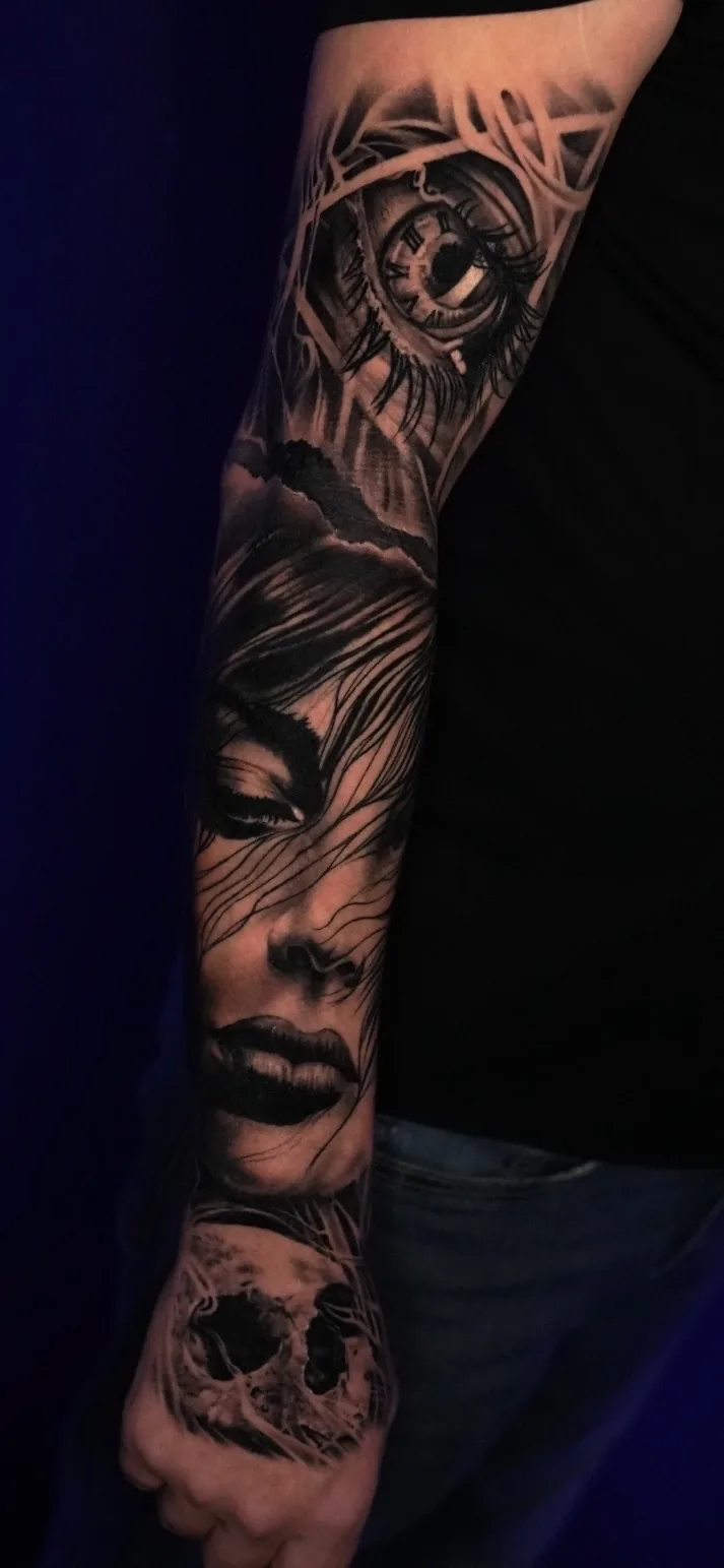 Black and grey woman portrait, eye, and skull arm sleeve by Nate Cummings