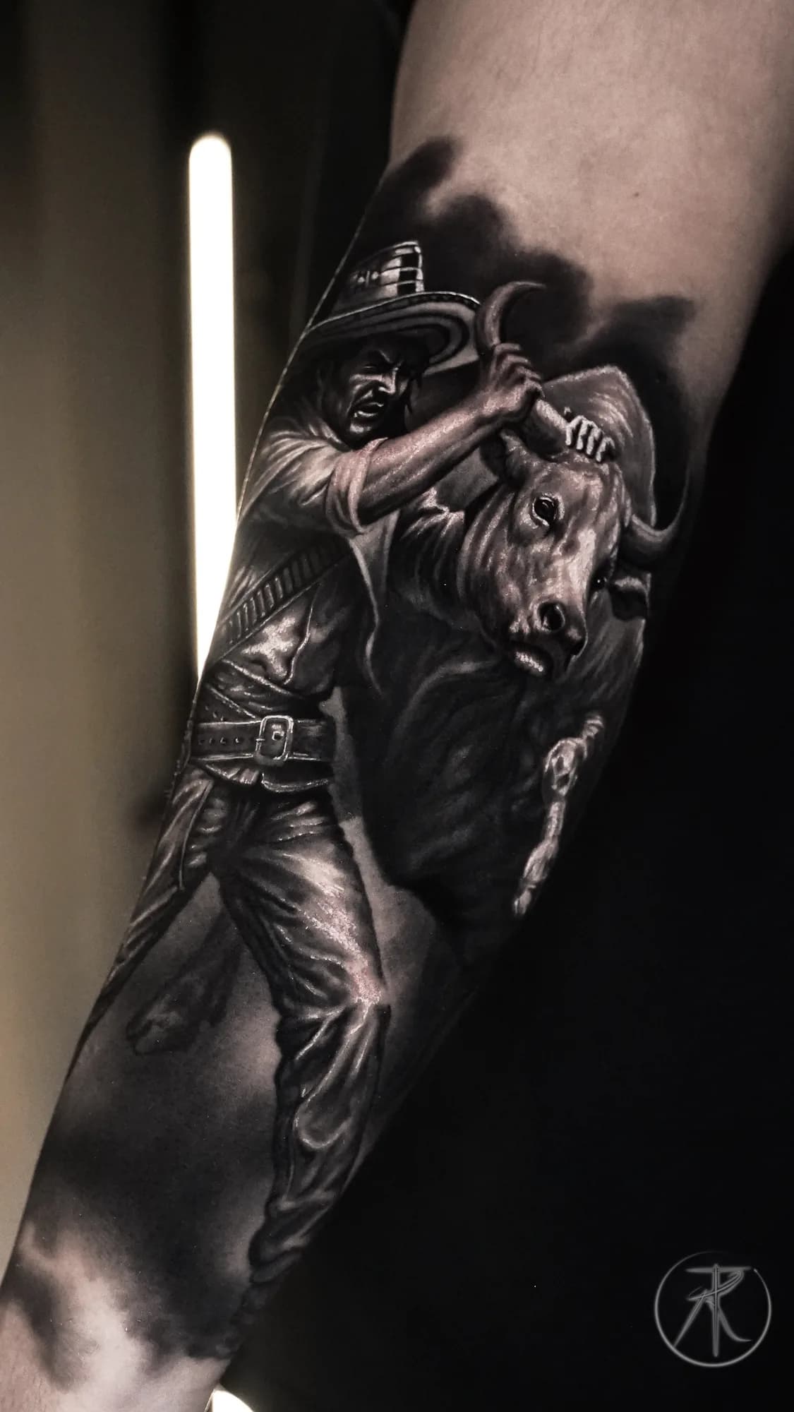Black and grey cowboy and bull arm tattoo by Taro Bushido
